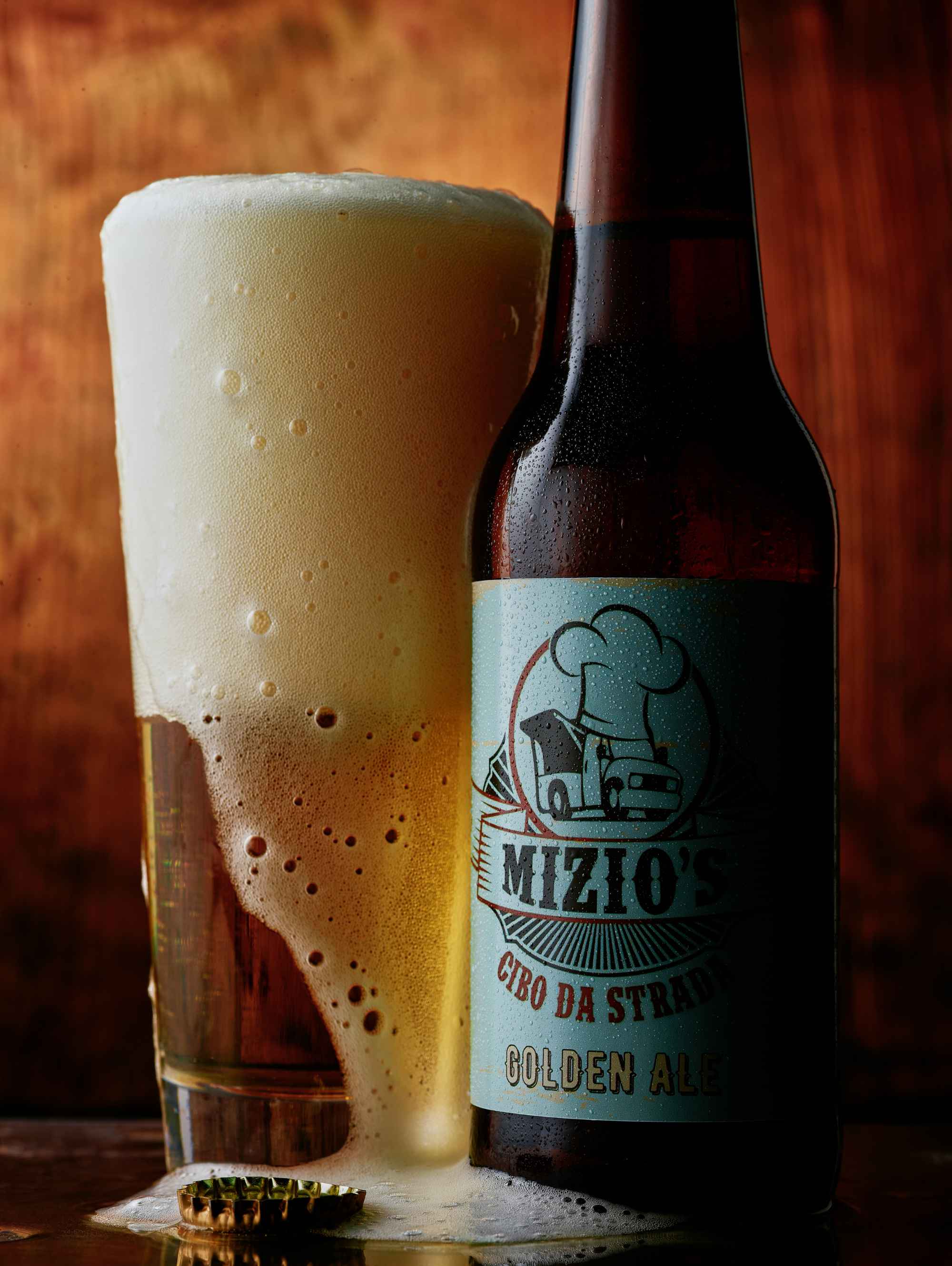 Mizio's Cibo da Strada Golden Ale bottle with overflowing pint